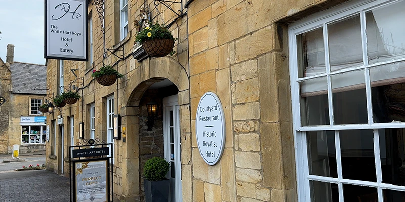 The White Hart Royal Hotel entrance with hanging baskets