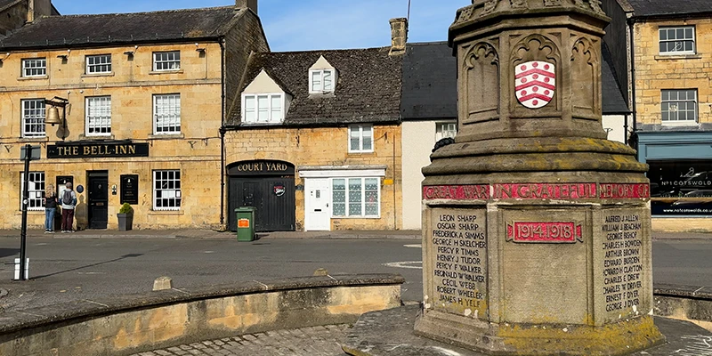 Moreton-in-Marsh war memorial and Bell Inn in market square