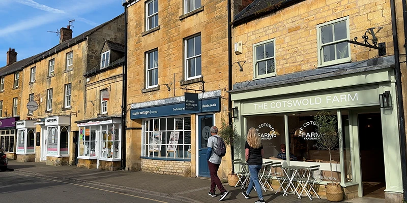 Cotswold Farm shopfront with walkers passing