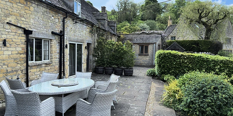 Broughwood Cottage's private terrace with garden seating, a luxury self-catering holiday cottage in Snowshill
