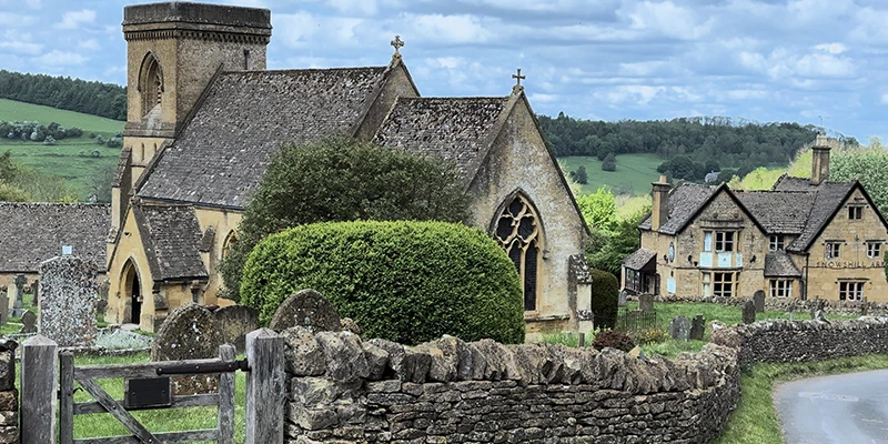 St Barnabas Church and Snowshill Arms pub with the churchyard between them
