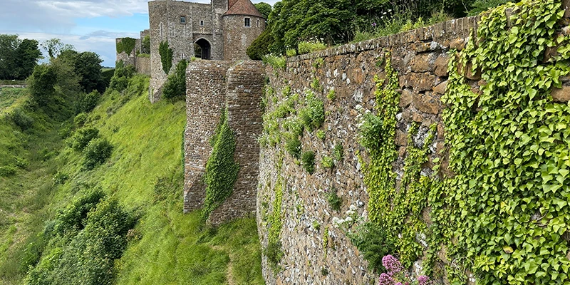 The outer wall and towers of Dover Castle following the contour of the hill