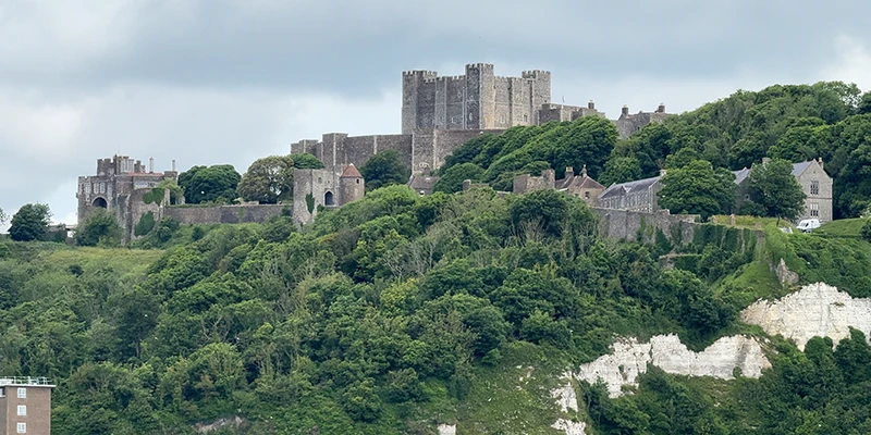 Dover Castle seen across the green hillside