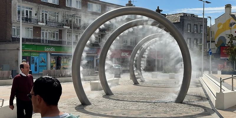 The circular steel mist sculpture in Market Square, Dover