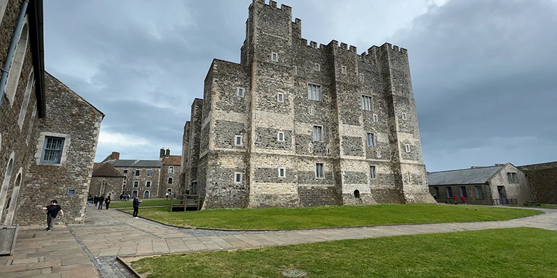 The Great Tower at Dover Castle seen across the grass of the inner bailey