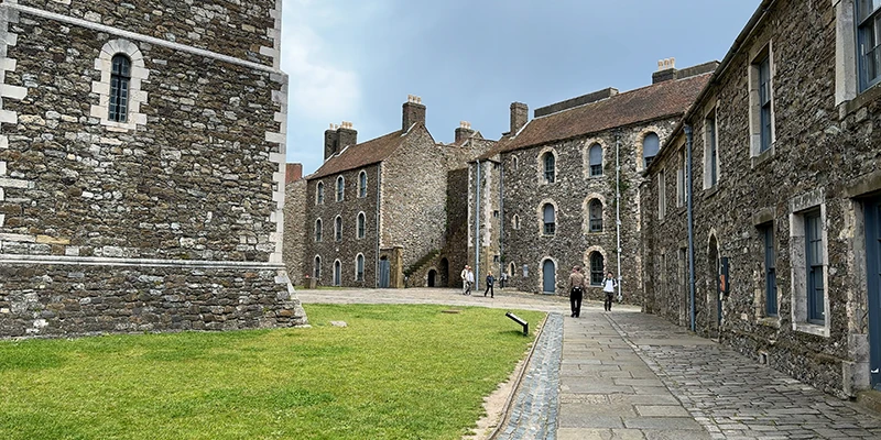 Stone buildings and lawn inside the walls of Dover Castle