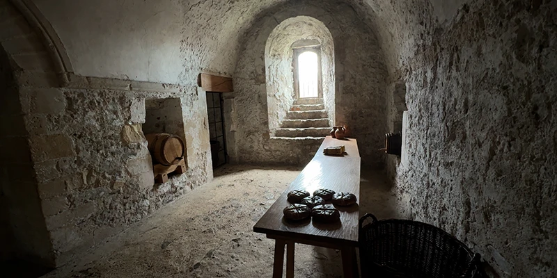 Small vaulted chamber with a table inside Dover Castle