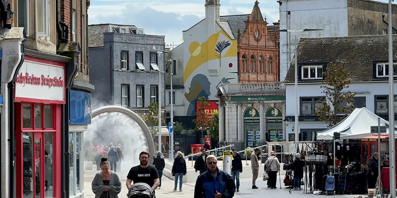 Pedestrians and shops in central Dover