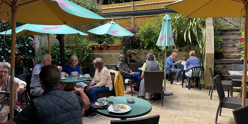 Customers at the outdoor terrace of a cafe in Dover