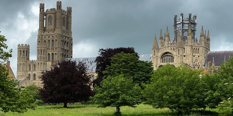 Ely Cathedral seen across the green in the center of the city