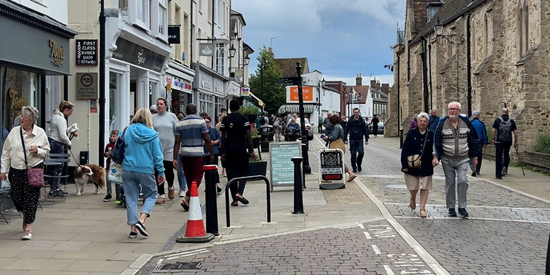 Pedestrians on a busy shopping street in Ely