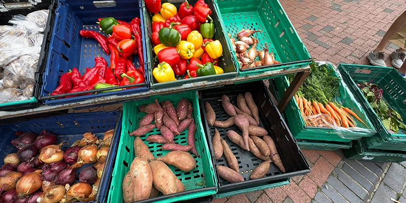 Crates of peppers, onions, carrots and sweet potatoes at Ely market
