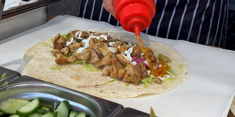 Mexican street food being prepared at a stall in Ely Market Place