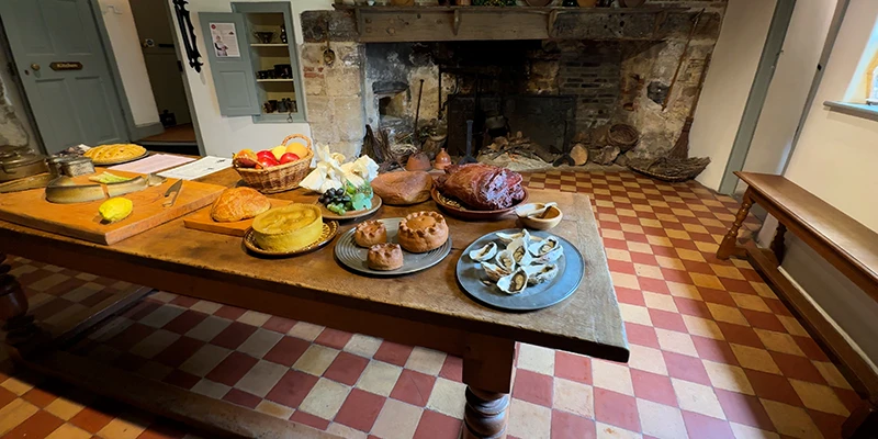 The kitchen of Oliver Cromwell's House laid with period food
