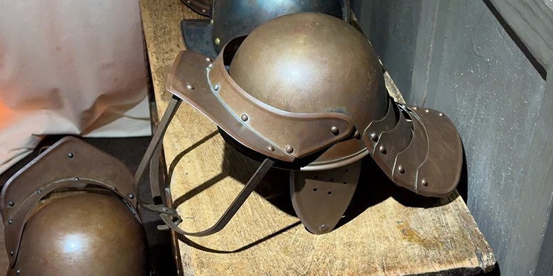 Civil War helmets and armor on display at the Ely Museum