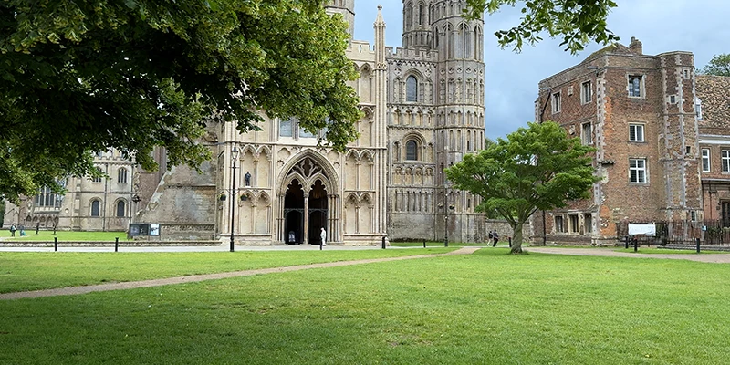 The west front of Ely Cathedral seen across the green