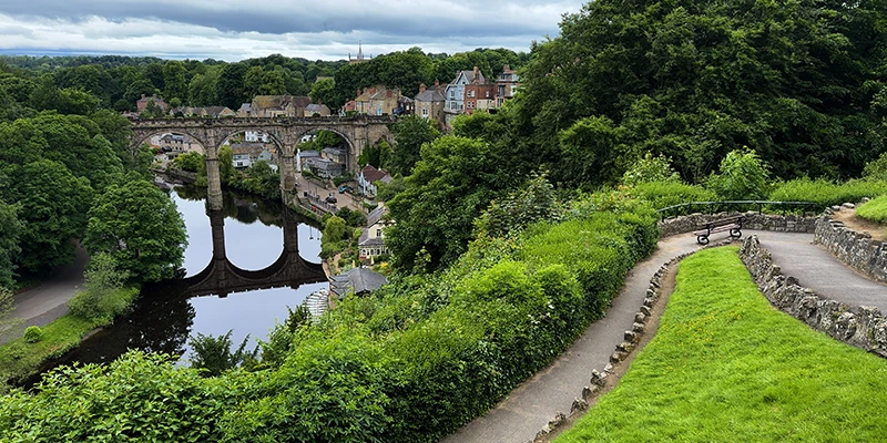 The viaduct and the town of Knaresborough reflected in the River Nidd