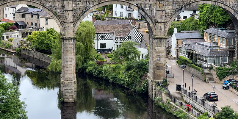 Looking down the River Nidd through an arch of the Knaresborough viaduct