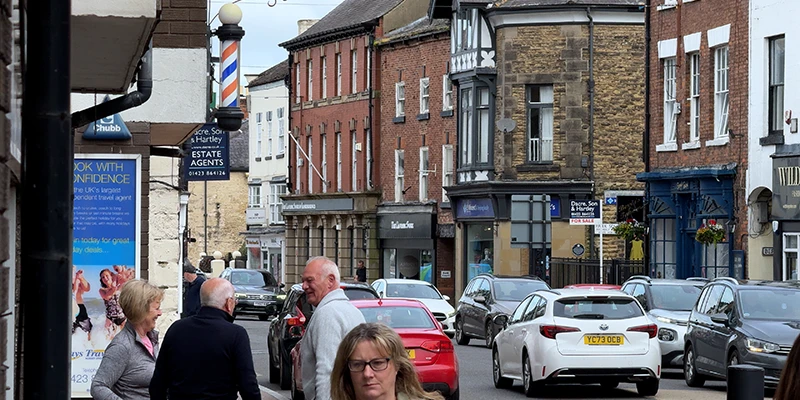 Shops and pedestrians on the High Street in Knaresborough