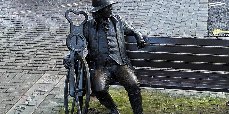 The bronze statue of Blind Jack, John Metcalf, seated on a bench in Knaresborough