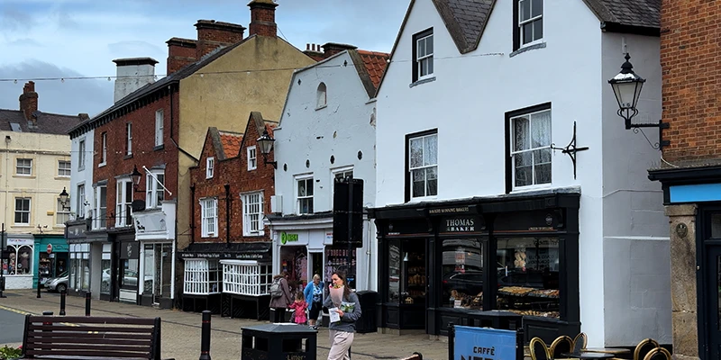 Shops and white-fronted buildings around Knaresborough Market Place