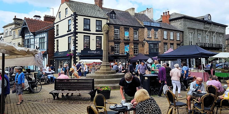 Stalls and crowds on market day in Knaresborough Market Place