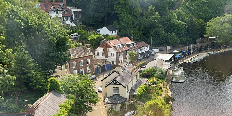 Looking down at the river and the town from a train crossing the viaduct