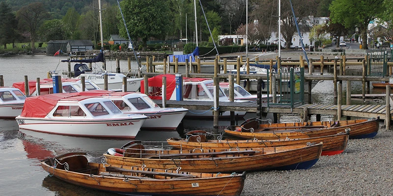 Small boats moored at Waterhead pier at the north end of Lake Windermere