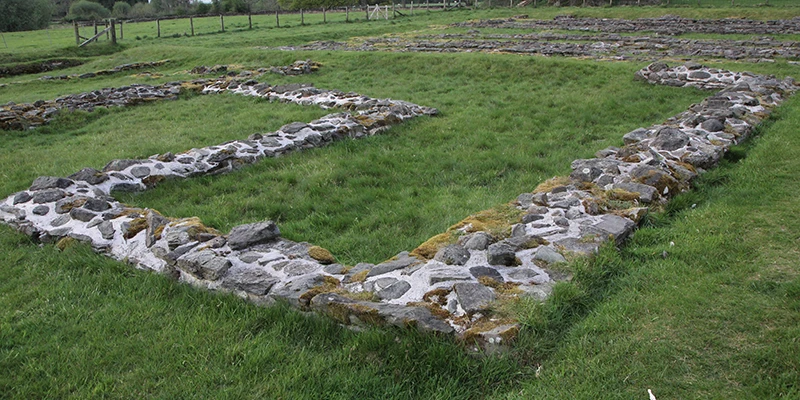 The low stone foundations of Galava Roman fort at Borrans Field, Ambleside