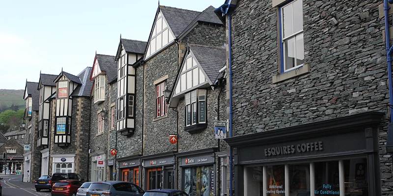 Slate-built shops and cafés along a street in Ambleside