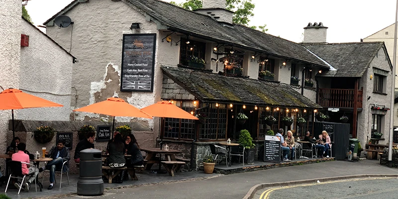 Cafe with orange umbrellas in Bowness
