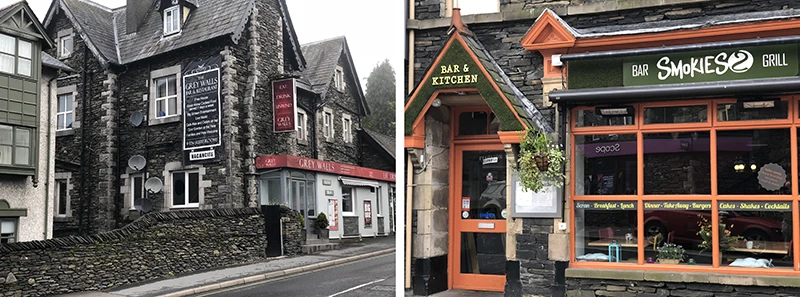 Bar and grill with an orange painted front beside a stone building in Windermere