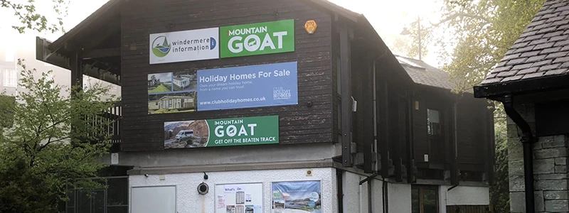 Mountain Goat tour office building with signs in Windermere