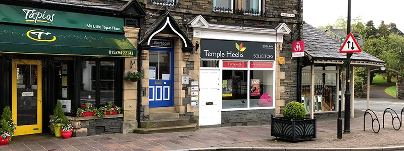 Shops and a bus shelter near the station end of Windermere town