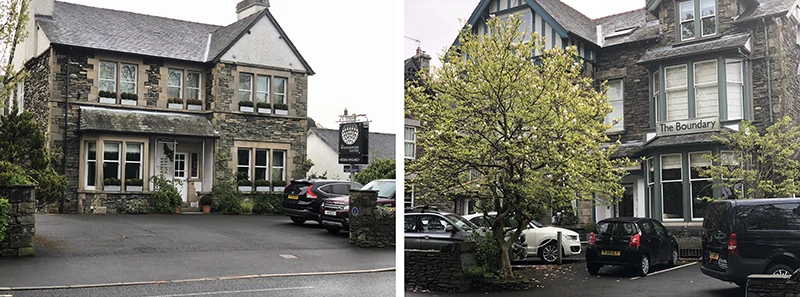 Stone guesthouses with parking areas on a residential street in Windermere