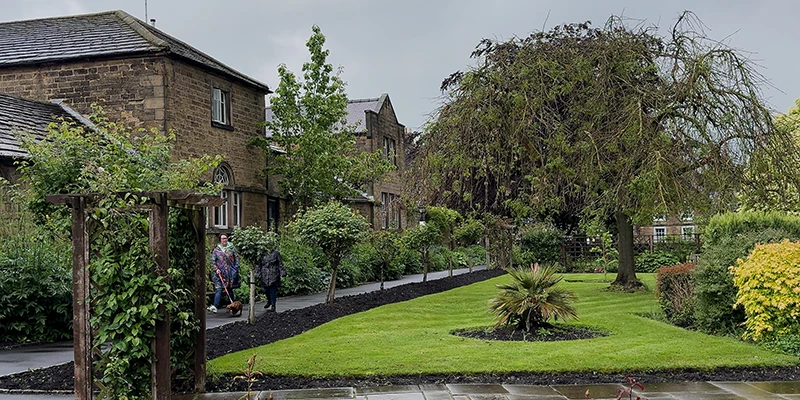 A stone building and garden beside the river in Bakewell