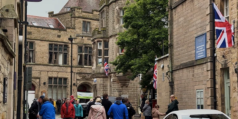 Visitors filling a street in the center of Bakewell