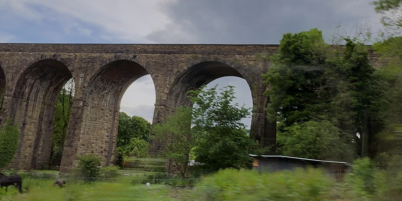 The stone arches of the old railway viaduct near Castleton