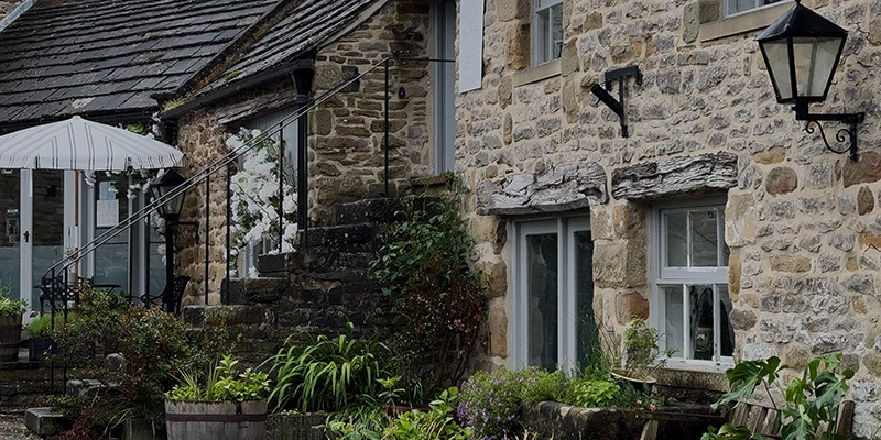 A row of stone cottages along a lane in Eyam