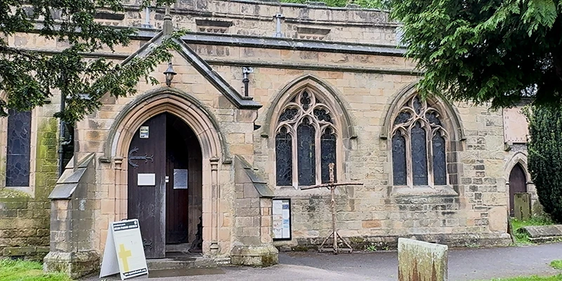 The arched stone entrance porch of St. Lawrence's church