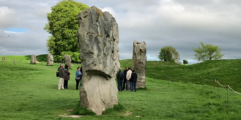 Stones at Avebury with the village houses behind them