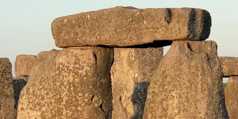 The sarsen circle and trilithons at Stonehenge in evening light