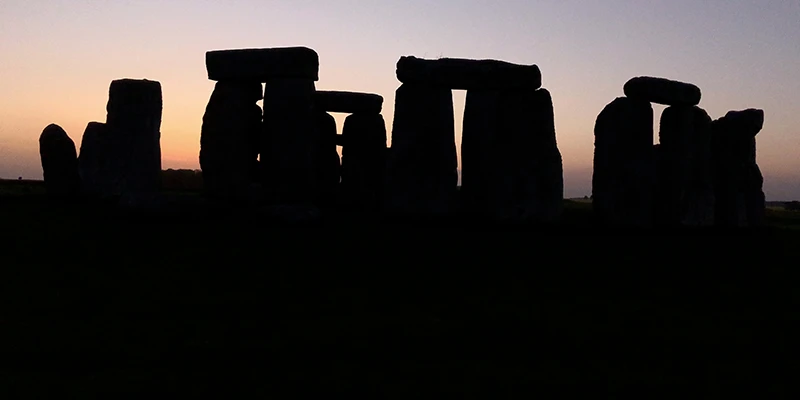 Stonehenge in silhouette against the evening sky