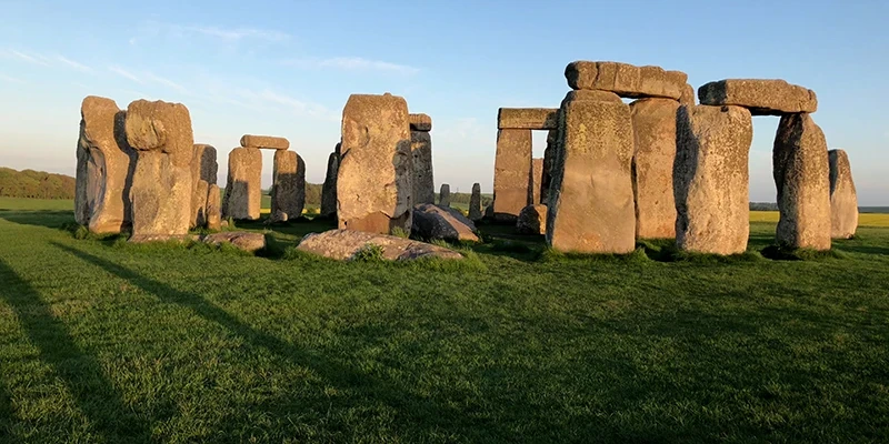 The stone circle at Stonehenge seen across the grass