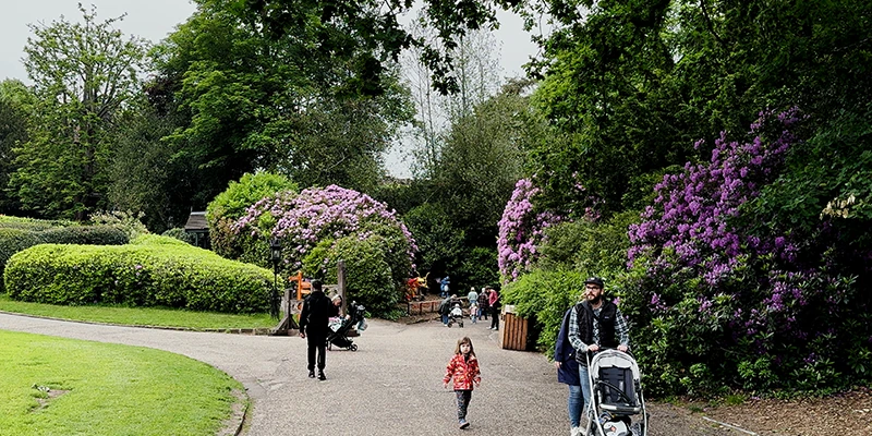 Visitors walking through the gate passage into Warwick Castle
