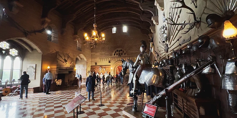The Great Hall at Warwick Castle, its walls covered with arms and armor