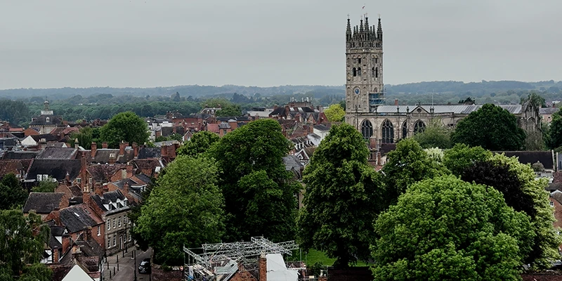 Timber-framed and Georgian brick buildings along a street in the town of Warwick, England