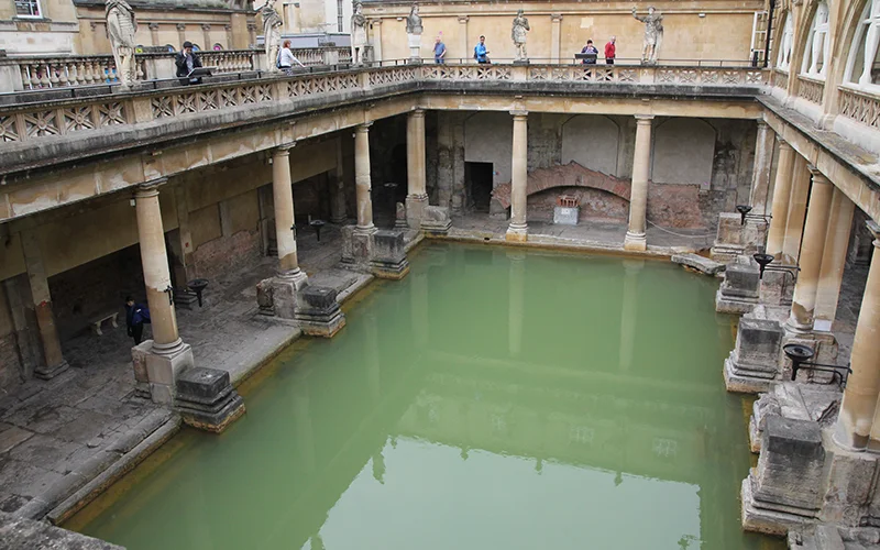 The Great Bath at the Roman Baths in Bath with its green water