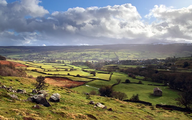 Green valley and stone-walled fields in the Yorkshire Dales