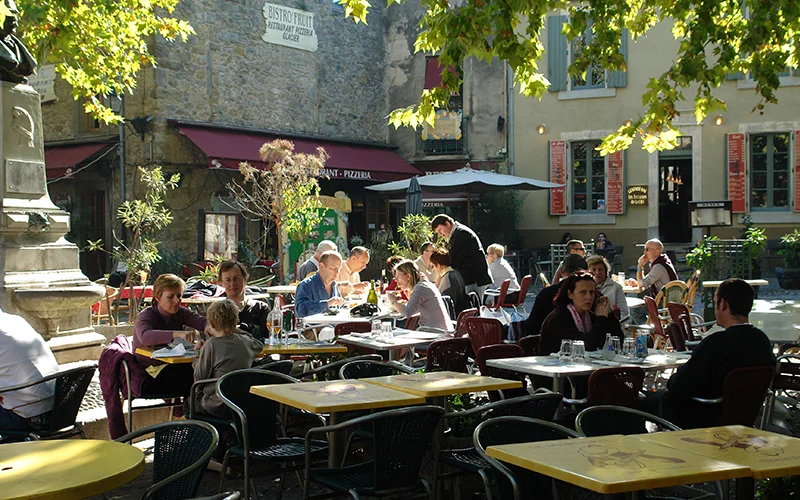 Outdoor cafe tables in a square inside the walls of Carcassonne